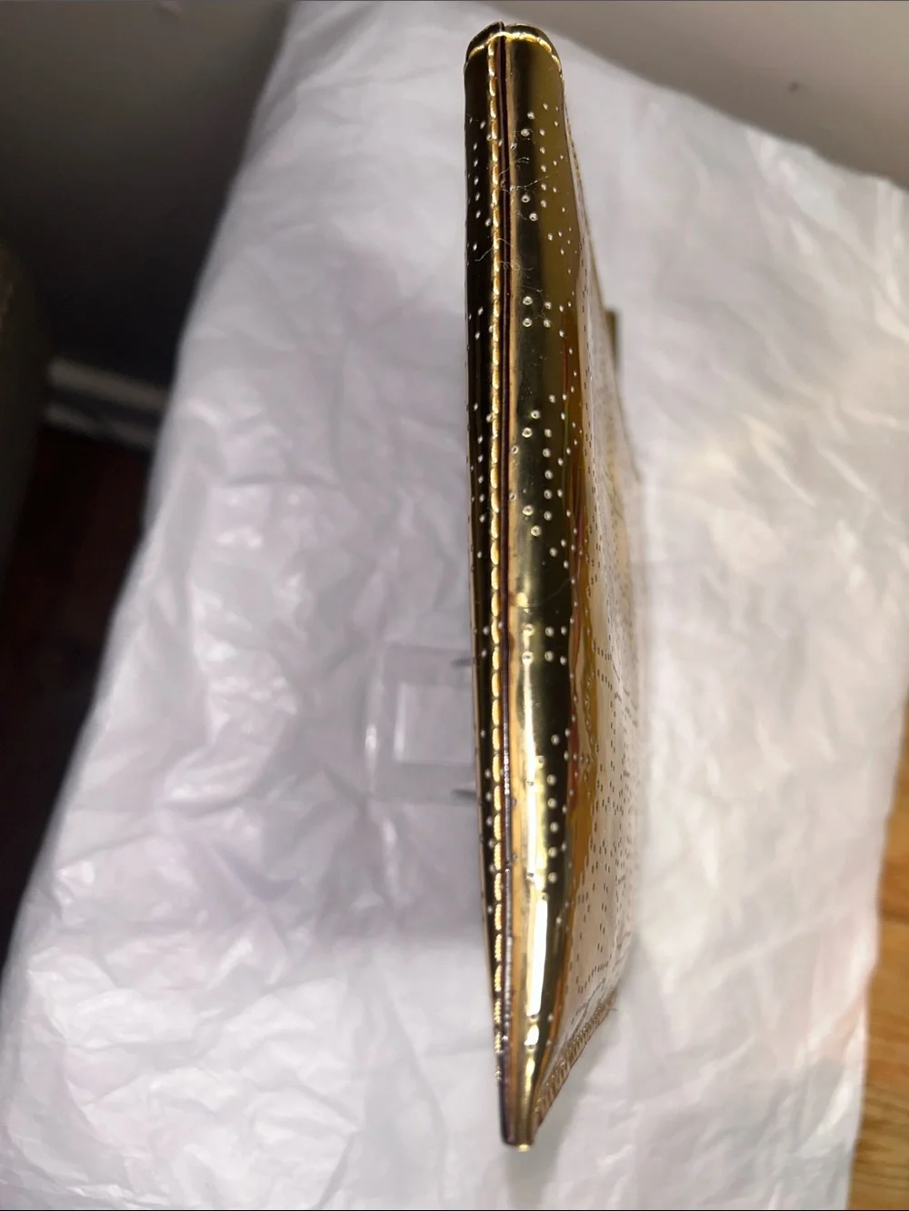 Kate Spade New York metallic gold pouch featuring a perforated spade pattern EUC